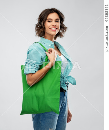 woman with reusable canvas bag for food shopping woman with reusable canvas bag for food shopping 66868531