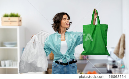 woman with plastic and reusable shopping bag woman with plastic and reusable shopping bag 66868534