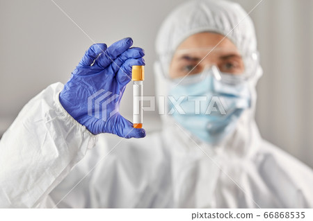 scientist in protective mask with test tube 66868535