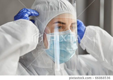 doctor in protective wear, mask and face shield doctor in protective wear, mask and face shield 66868536