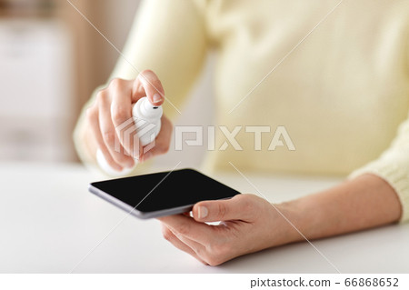 close up of woman hands cleaning smartphone 66868652