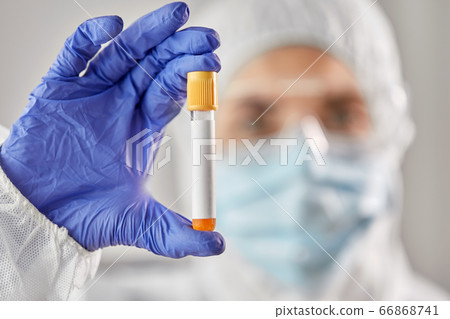 scientist in protective mask with test tube 66868741