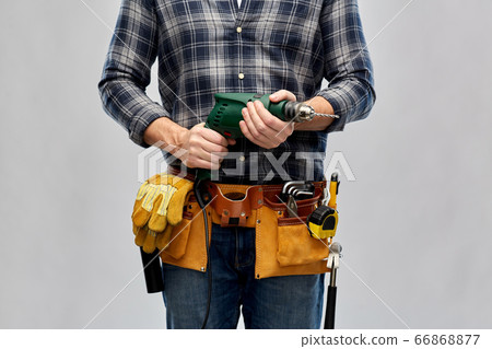 male repairer or builder with drill and work tools male repairer or builder with drill and work tools 66868877