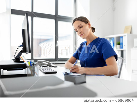 doctor or nurse with clipboard working at hospital 66869004