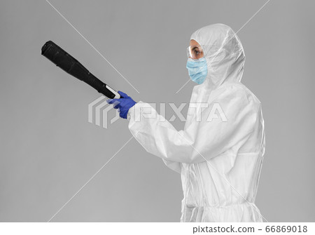 sanitation worker in hazmat with pressure washer sanitation worker in hazmat with pressure washer 66869018