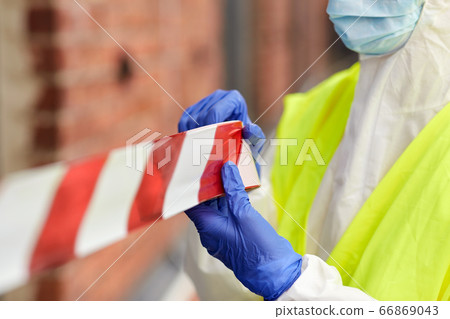healthcare worker sealing door with caution tape healthcare worker sealing door with caution tape 66869043