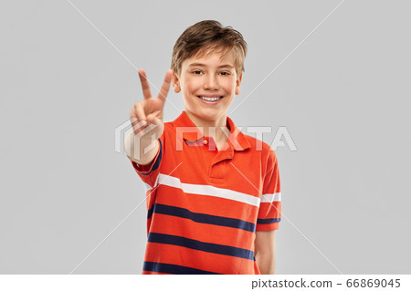 portrait of happy smiling boy in red polo t-shirt 66869045