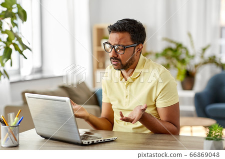 sad man with laptop working at home office sad man with laptop working at home office 66869048