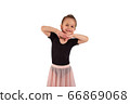 Portrait of cute little girl wearing dance suit, smiling and propping up her head with hands , isolated on white background 66869068