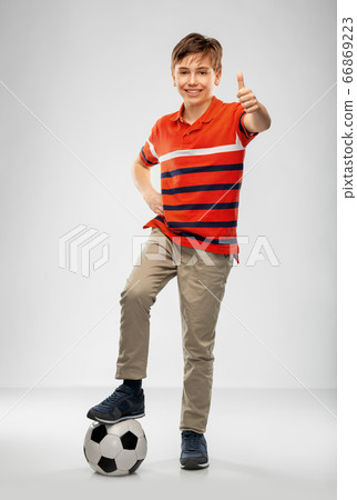 happy boy with soccer ball showing thumbs up happy boy with soccer ball showing thumbs up 66869223