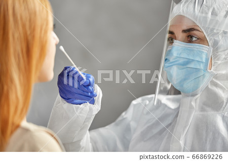 doctor in protective wear making coronavirus test doctor in protective wear making coronavirus test 66869226