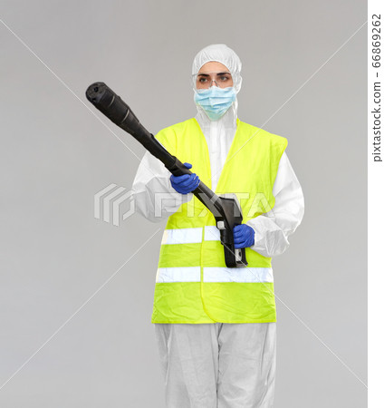 sanitation worker in hazmat with pressure washer 66869262