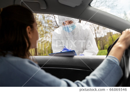 healthcare worker with clipboard and woman in car healthcare worker with clipboard and woman in car 66869346