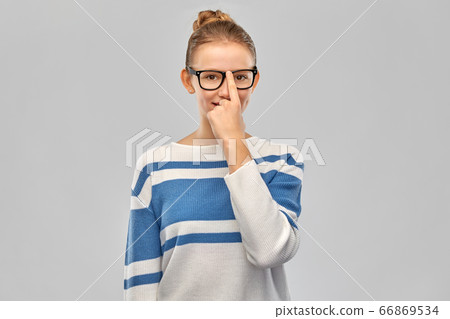 smiling teenage student girl in glasses 66869534