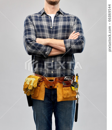 male worker or builder with working tools on belt 66869544