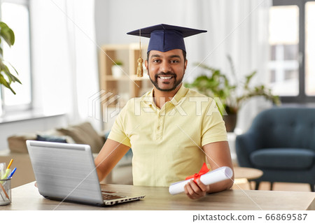 indian student with laptop and diploma at home indian student with laptop and diploma at home 66869587