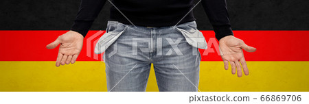 close up of man showing empty pockets over grey 66869706