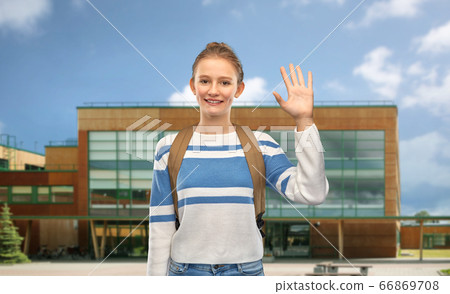 smiling teenage student girl with school bag 66869708