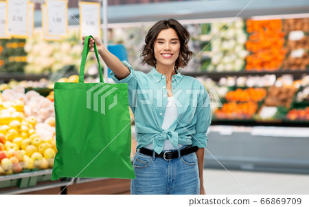 woman with reusable canvas bag for food shopping 66869709