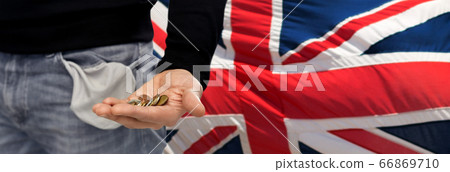 close up of man showing coins and empty pockets close up of man showing coins and empty pockets 66869710