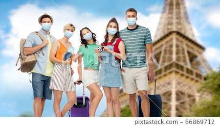 friends in masks with travel bags at eiffel tower friends in masks with travel bags at eiffel tower 66869712