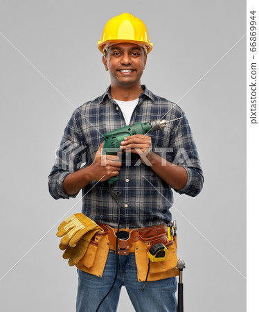 happy indian builder in helmet with electric drill happy indian builder in helmet with electric drill 66869944