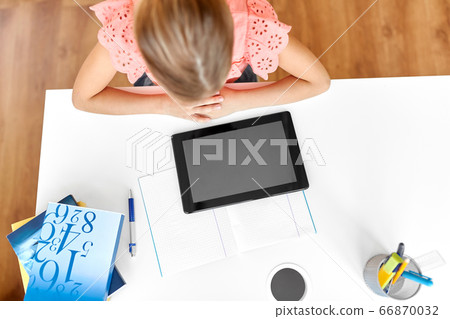 little student girl with tablet computer at home little student girl with tablet computer at home 66870032