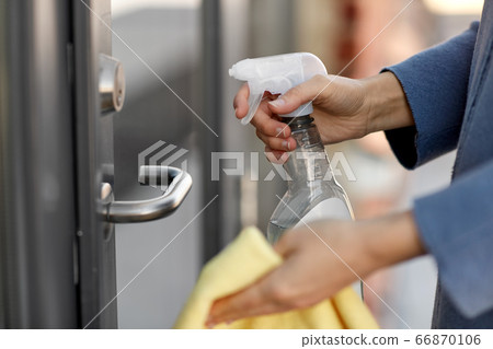 hand cleaning door handle with detergent and rag hand cleaning door handle with detergent and rag 66870106