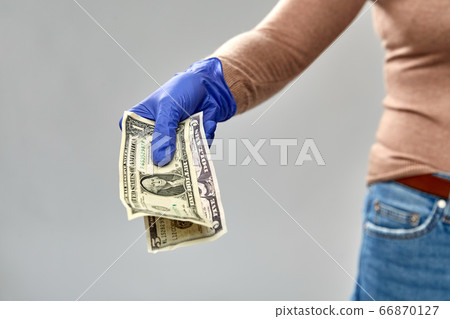 close up of hand in medical glove with money close up of hand in medical glove with money 66870127