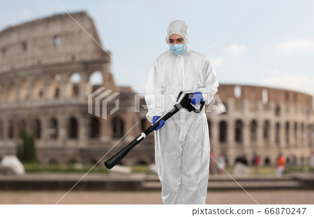 sanitation worker in hazmat with pressure washer sanitation worker in hazmat with pressure washer 66870247
