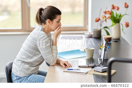 woman with laptop working at home office 66870322