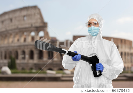 sanitation worker in hazmat with pressure washer sanitation worker in hazmat with pressure washer 66870485