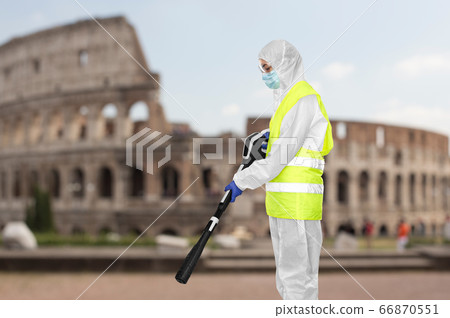 sanitation worker in hazmat with pressure washer sanitation worker in hazmat with pressure washer 66870551