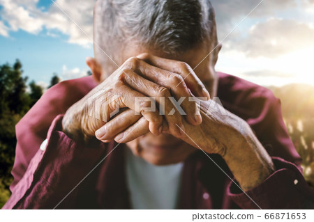 senior man covering his face with his hands. Depression and anxiety Copy space. senior man covering his face with his hands. Depression and anxiety Copy space. 66871653