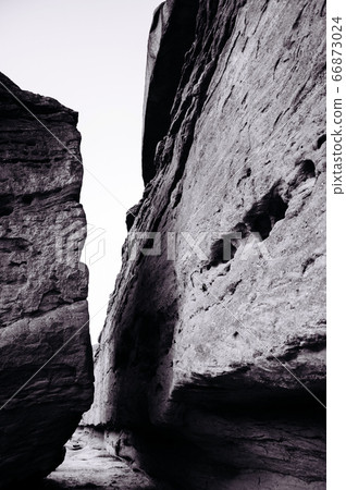 Sandstone rock cliff under evening light of Mekong river side. Thailand 66873024
