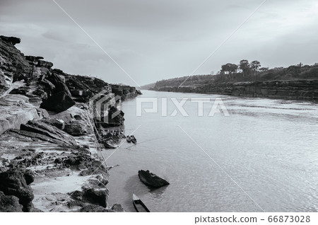 Large Sand stone canyon cliff shoreline of Mekong River. Thailand Large Sand stone canyon cliff shoreline of Mekong River. Thailand 66873028