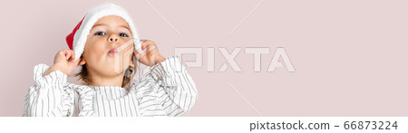 Portrait of toddler girl in red hat on Christmas. Surprise concept Portrait of toddler girl in red hat on Christmas. Surprise concept 66873224