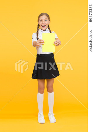 Schoolgirl studying textbook. Exciting literature. 66873388
