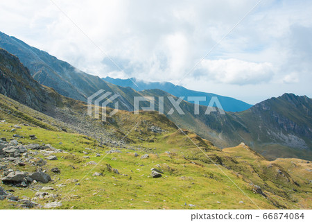 Breathtaking landscape in Carpathian mountains. With high green hills and rocks Breathtaking landscape in Carpathian mountains. With high green hills and rocks 66874084