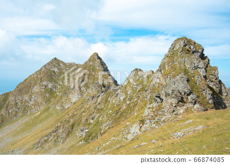 Breathtaking landscape in Carpathian mountains. With high green hills and rocks Breathtaking landscape in Carpathian mountains. With high green hills and rocks 66874085