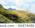 Beautiful mountain landscape with sheep on the hill 66874086