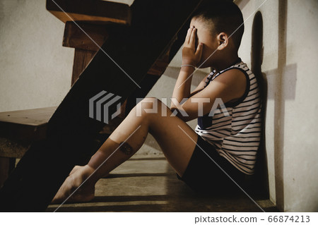 Neglected lonely child, Young boy sitting on the floor with Copy Space. Neglected lonely child, Young boy sitting on the floor with Copy Space. 66874213