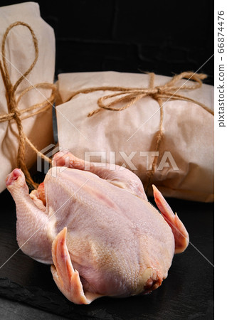 Fresh chicken carcass on a gray background, fresh meat, copy space, photo for grocery stores. dark background 66874476