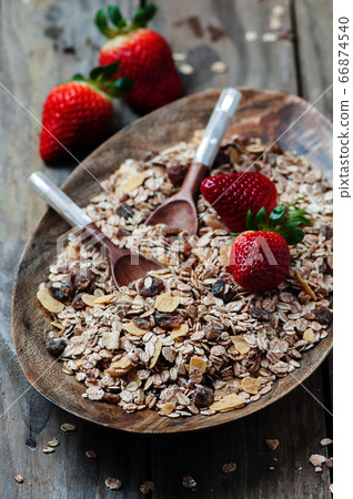 Homemade muesli with strawberry on the wooden Homemade muesli with strawberry on the wooden 66874540