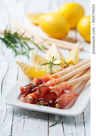 Smoked salmon with lemon and rosemary 66874920