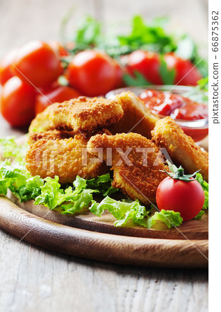 Chicken nuggets on the wooden table Chicken nuggets on the wooden table 66875362