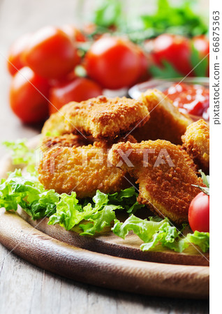 Chicken nuggets on the wooden table Chicken nuggets on the wooden table 66875363