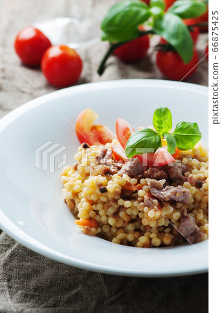 Cooked sardinain pasta fregola with tomato and Cooked sardinain pasta fregola with tomato and 66875425