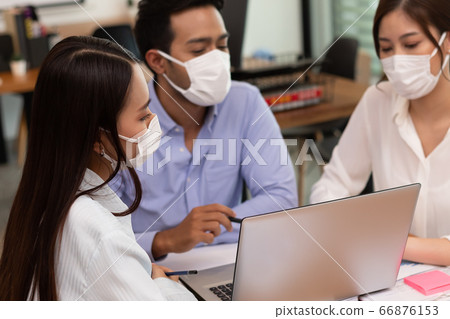Asian business man and women talk about job and wear masks.New nomal 66876153