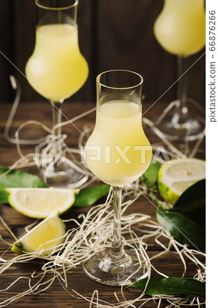Iralian traditional liqueur with lemons on the 66876266